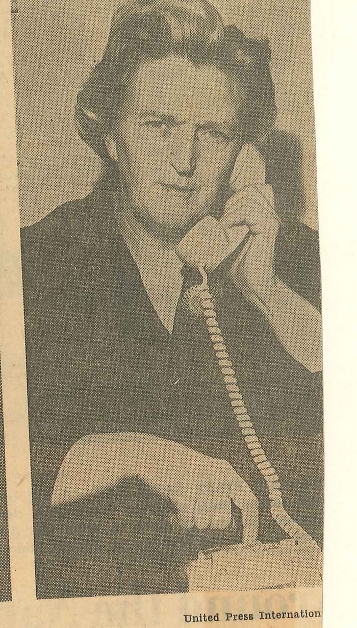 Newspaper portrait of Anna Spring-Hitz, the mother, on the telephone in Washington, 1965.